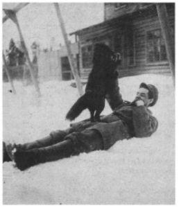 Image of Anatoly Serebriakoff in snow with a dog.